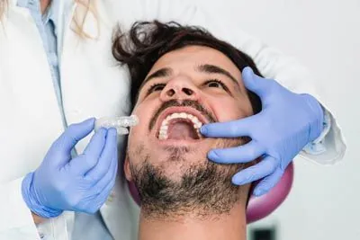 patient being fitted for new clear orthodontic aligners