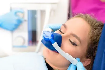 patient asleep during her procedure thanks to sedation services from Uptown Family Dental