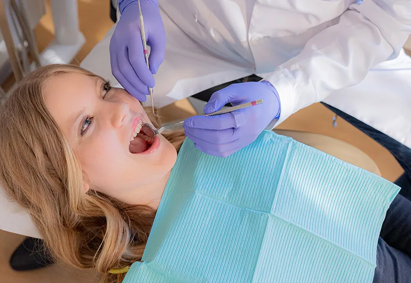 Dr. Bradley Parker of Uptown Family Dental in Portland, OR providing dental care for a patient