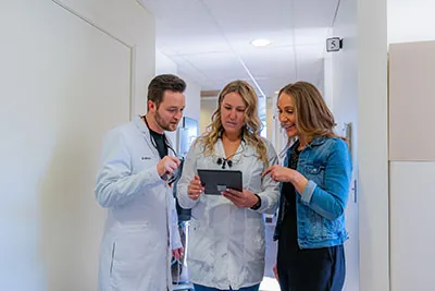 The friendly staff at uptown family dental discussing oral surgery options together. 