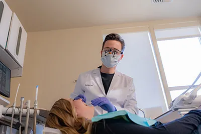 Dr. Moody working with a patient at uptown family dental.